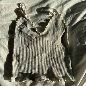 Cream Ribbed Ruffled Camisole with Scoop Neck and Sleeveless Design